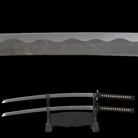Close-up of folded steel blade showing visible hada grain on Deadpool katana sword