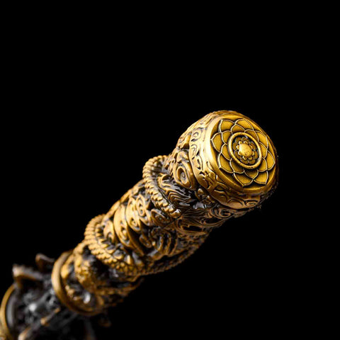 Sculpted alloy end of Jingu Bang staff replica with red and black finish