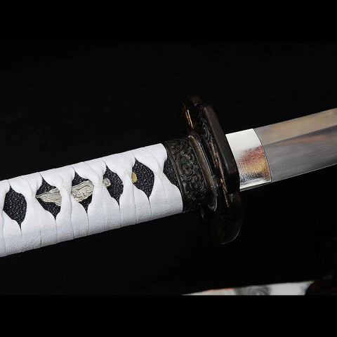 Close-up of spare bamboo mekugi pegs included with the katana