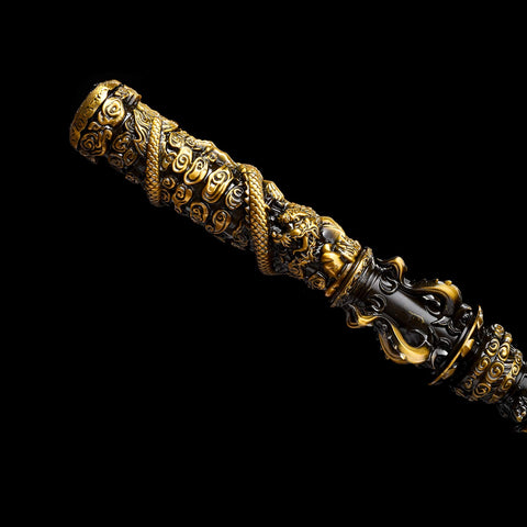 Sculpted alloy end of Jingu Bang staff replica with red and black finish