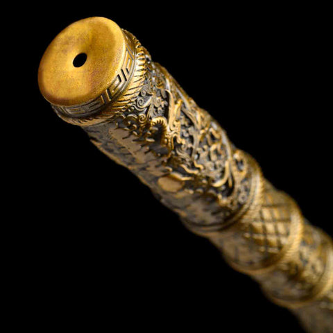Close-up of dragon engraved alloy fitting on Sun Wukong Ruyi Jingu Bang staff